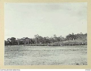 POM POM VALLEY, NEW GUINEA, 1944-02-16. A GENERAL VIEW OF MEN OF THE 21ST INFANTRY BRIGADE ON A FAREWELL PARADE DURING WHICH THE GENERAL-OFFICER-COMMANDING NEW GUINEA FORCE, LIEUTENANT-GENERAL SIR ..