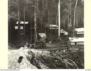 LAE - NADZAB ROAD, NEW GUINEA. 1944-03-09. THE ROADSIDE CAMP OF NO. 2 PLATOON, 2/9TH FIELD COMPANY, ROYAL AUSTRALIAN ENGINEERS, AMONG TALL TREES AT MARKHAM POINT