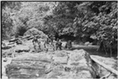 Yagip River: people wading across