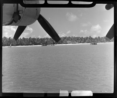 Boats in lagoon to transfer passengers to the TEAL (Tasman Empire Airways Limited) Flying boat, Akaiami, Aitutaki, Cook Islands