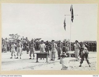 CAPE WOM, NEW GUINEA, 1945-09-13. MAJOR GENERAL H.C.H. ROBERTSON, GENERAL OFFICER COMMANDING 6 DIVISION, ADDRESSING TROOPS OF 6 DIVISION, DURING THE SURRENDER CEREMONY HELD AT CAPE WOM AIRSTRIP. ..