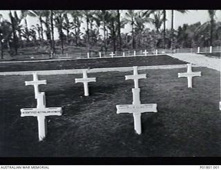 Jacquinot Bay, New Britain. c.1945. Jacquinot Bay War Cemetery, 25 miles south of Rabaul, showing the graves of Australian soldiers Private A. Claridge and Driver O. G. Greenaway, an unidentified ..