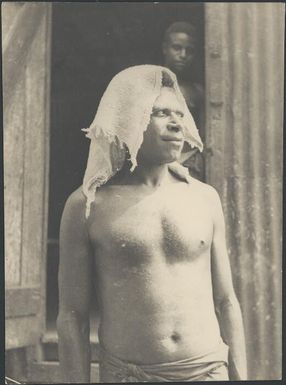 Man wearing headgear, Awar, Sepik River, New Guinea, 1935 / Sarah Chinnery