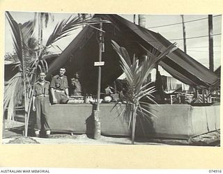 SOUTH ALEXISHAFEN, NEW GUINEA. 1944-07-24. THE CANTEEN STAFF AT HEADQUARTERS, 5TH DIVISION. THEY ARE:- N211490 PRIVATE M.A. HAKAINSSON (1); NX116771 DRIVER T. MALONEY (2); Q21734 CORPORAL G.V GRANT ..