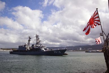 The Japanese Maritime Self Defense Force JDS YAMAGIRI (TV 3515) is assisted by a tugboat as it enters U.S. Naval Station Pearl Harbor, Hawaii, on Aug. 18, 2006. More than 1,000 Japanese Sailors are visiting Pearl Harbor during a worldwide training and international relations cruise. (U.S. Navy photo by Mass Communications SPECIALIST 1ST Class Dennis C. Cantrell) (Released)