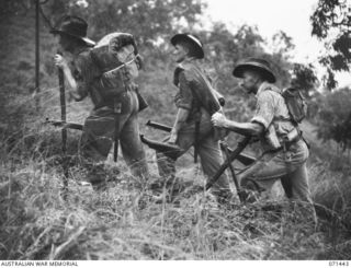 PORT MORESBY, NEW GUINEA, 1944-03-24. Q14463 PRIVATE J. LENTELL (1); QX56430 PRIVATE J.W. MILES (2) AND Q271046 PRIVATE C.E. BESS (3), POSING FOR A PHOTOGRAPH TAKEN FOR V93667 CAPTAIN G.H. ALLEN, A ..