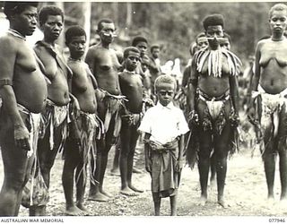 KAMALGAMAN ANCHORAGE, JACQUINOT BAY, NEW BRITAIN. 1944-12-31. NATIVE WOMEN DANCERS POSE FOR THEIR PHOTOGRAPH DURING A SING-SING IN THE AUSTRALIAN NEW GUINEA ADMINISTRATIVE UNIT NATIVE COMPOUND. THE ..