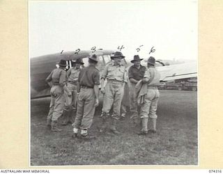 WAU, NEW GUINEA. 1944-07-02. MEMBERS OF THE EMPIRE PARLIAMENTARY DELEGATION BEING GREETED BY SENIOR AUSTRALIAN ARMY OFFICERS AS THEY ALIGHT FROM THEIR ROYAL AUSTRALIAN AIR FORCE AVRO ANSON ..