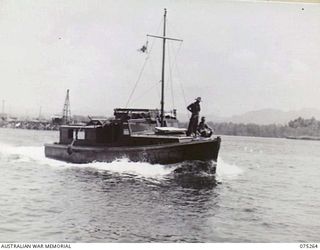 MADANG, NEW GUINEA. 1944-08-18. THE MEDICAL LAUNCH AN1567 OF THE NEW GUINEA SEA AMBULANCE TRANSPORT COMPANY MOVING THROUGH THE WATER AT 15 KNOTS AS SHE LEAVES THE HARBOUR ON HER DAILY TRIP TO ..
