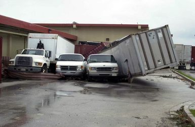 Trailers are tangled with Vans as a result of super-typhoon Pongsona Sunday December 8th at Andersen Air Force Base (AFB), Guam