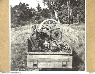 PORT MORESBY, NEW GUINEA. 1943-11-15. A NORMAL 25-POUNDER GUN OF THE 2/5TH AUSTRALIAN FIELD REGIMENT HICH HAS BEEN STRIPPED TO ITS COMPONENTS IS SHOWN PACKED INTO A THREE TON TRUCK. THIS PHOTOGRAPH ..
