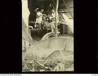 TOROKINA, BOUGAINVILLE ISLAND, SOLOMON ISLANDS. C. 1945-02. GROUP PORTRAIT TAKEN IN THE RAAF DENTAL SECTION AT TOROKINA