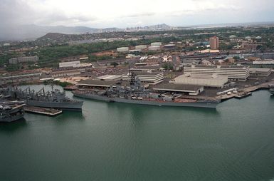 The battleship USS MISSOURI (BB-63) is moored near the fast combat support ship USS SACRAMENTO (AOE-1) while the two vessels are in the region to take part in exercise RimPac '90