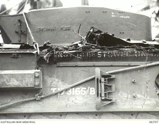 MADANG, NEW GUINEA. 1944-10-12. BRANCHES PROTRUDING FROM THE TRACK OF A CHURCHILL VII TANK COLLECTED WHILE NEGOTIATING UNDERGROWTH DURING TESTS CONDUCTED AT HQ 4 ARMOURED BRIGADE