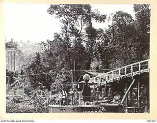 KALUMALAGI RIVER, NEW BRITAIN, 1945-08-12. THE HOSPITAL LAUNCH AH2093 AT ANCHOR IN THE RIVER NEAR THE BRIDGE. THE VESSEL IS MANNED BY 1 WATER AMBULANCE CONVOY