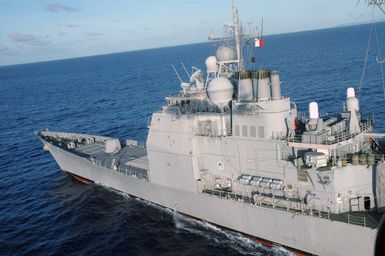 A high-angle view showing the US Navy (USN) Ticonderoga Class Guided Missile Cruiser (Aegis) USS COWPENS (CG 63), underway in the Pacific Ocean, during the opening phases of a joint US-Russian Naval Exercise. A Russian Federation Navy vessel made the first visit to the US Territory of Guam in order to participate in a joint humanitarian assistance and disaster relief exercise with USN Ships