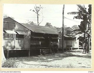 TOROKINA, BOUGAINVILLE ISLAND. 1945-01-18. N240739 SIGNALLER J.G. CAIN, DESPATCH RIDER, ENTERING THE MAIN SIGNALS OFFICE OF "B" CORPS OF SIGNALS