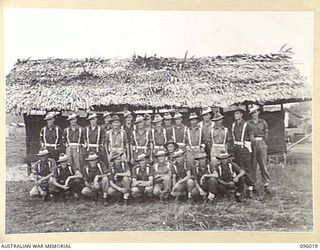 CAPE WOM, WEWAK AREA, NEW GUINEA. 1945-09-05. AN INFORMAL GROUP OF HEADQUARTERS DETACHMENT, 6 DIVISION PROVOST COMPANY. THE DETACHMENT CONSISTS OF THREE SECTIONS, THE REMAINDER ARE DISPERSED OUT TO ..