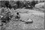 Schrader Range: Kalam man with netbag sits by trail