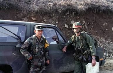 COL. Donald Oura, commander, 29th Brigade, Hawaii Army National Guard, speaks with LT. COL. George Close, commander, 1ST Bn., 5th Inf., 25th Inf. Div., during the joint U.S./Korea exercise Team Spirit '85. Oura is acting as the chief controller for the 1st Brigade, 25th Inf. Div., during the exercise