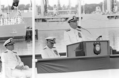 ADM Sylvester R. Foley Jr. speaks during the ceremonies marking his assumption of command of the U.S. Pacific Fleet. Seated behind him is CHIEF of Naval Operations ADM Thomas B. Hayward, left, and CHIEF of Naval Operations Designate ADM James D. Watkins