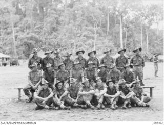 Group portrait of members of 10 Platoon, B Company, 58/59 Infantry Battalion. Identified, back row, left to right: Private (Pte) Olsen; Pte Foots; Pte Tweed; Pte Kitchen; Pte Murray; Pte Allen; Pte ..