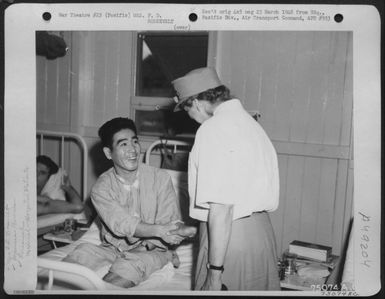 During Her Tour Of The Pacific Bases Mrs. F. D. Roosevelt Visits K. Komota, A Wounded Japanese American Soldier At Fiji Islands, 1943. (U.S. Air Force Number 75074AC)