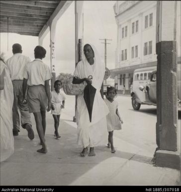 Woman and child walking through town