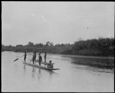 Two canoes of standing paddlers, Ramu River, New Guinea, 1935 / Sarah Chinnery