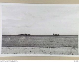 PORT MORESBY. AIRCRAFT A18-10 ("CENTAURUS") RIGHT, AND A18-11 ("CALYPSO") LEFT, OFF ELA BEACH, SOUTH EAST OF PORT MORESBY, OUTSIDE FAIRFAX HARBOUR. THIS FORMS A SMOOTH SITDOWN FOR FLYING BOATS ..