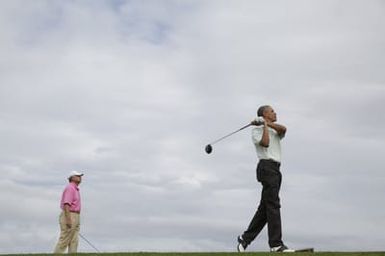 Barack Obama plays golf with Prime Minister Najib Razak, Joe Paulsen, and Mike Brush in Kaneohe Bay, Hawaii, December 24, 2014