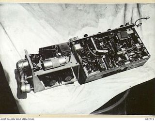 MADANG, NEW GUINEA. 1944-10-12. THE NO. 19 SET M3 FROM A CHURCHILL VII TANK WITH ITS FRONT PANEL VIEWED FROM BELOW. THE TANK IS ENGAGED IN TESTS AT HQ 4 ARMOURED BRIGADE