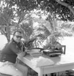 Man and woman with books and tape-recorder