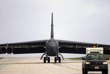 The first of six US Air Force (USAF) B-52 Stratofortress bombers from Minot Air Force Base (AFB), North Dakota (ND) taxis to their parking spaces after landing at Andersen Air Force Base (AFB), Guam (GU) in support of the US Pacific Command's (PACOM) request for a rotational bomber force