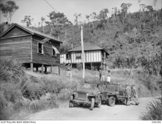 REINHOLD HIGHWAY, NEW GUINEA. 1943-08-25. THE FIRST TWO JEEPS TO TRAVERSE THE NEWLY COMPLETED 68 MILE MILITARY ROAD, LEAVING EDIE CREEK FOR BULLDOG ON THE RETURN TRIP. THIS 68 MILE HIGHWAY WAS ..