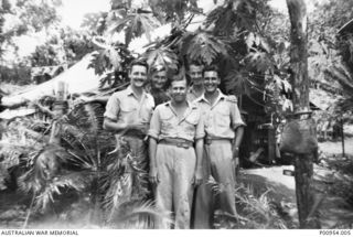 INLAND FROM PORT MORESBY, NEW GUINEA. 1943-11. UNIT NO 1 WIRELESS UNIT RAAF. JAPANESE KANA WIRELESS INTERCEPT OPERATORS' CAMP SITE AND OPERATIONS AREA. THE OPERATORS SHOWN ARE:- LEFT TO RIGHT:- ..