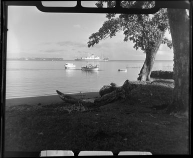 Apia waterfront, Upolu, Samoa, showing the ship Tofua in background and small boats in the lagoon