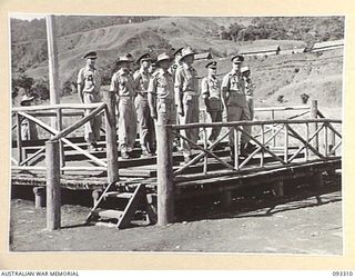 NADZAB AREA, NEW GUINEA, 1945-06-27. HIS ROYAL HIGHNESS, THE DUKE OF GLOUCESTER, GOVERNOR-GENERAL OF AUSTRALIA (3) AND SENIOR OFFICERS ON THE SALUTING BASE, DURING THE MARCH PAST OF THE PACIFIC ..