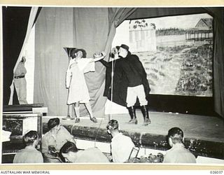 PAPUA, NEW GUINEA. 1942-07. A SCENE FROM A SKETCH PRESENTED BY THE PORT MORESBY CONCERT PARTY, FORMED FROM AMONG THE PERSONNEL OF AN AUSTRALIAN INFANTRY BRIGADE FOR THE ENTERTAINMENT OF AUSTRALIAN ..