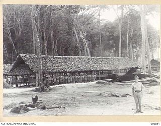 FAURO ISLAND, BOUGAINVILLE AREA. 1945-11-11. JAPANESE TROOPS IN NO. 9 JAPANESE AREA LINED UP FOR INSPECTION OUTSIDE THEIR SLEEPING HUT, DURING THE VISIT OF LIEUTENANT COLONEL H.L.E. DUNKLEY, ..