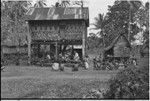 Land litigation meeting: villagers listen to claims, anthropologist Edwin Hutchins (standing) records