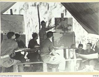 SIAR, NEW GUINEA. 1944-06-19. TROOPS OF A COMPANY, 58/59TH INFANTRY BATTALION, ATTENDING A MAP READING LECTURE. IDENTIFIED PERSONNEL ARE:- QX54443 PRIVATE K. KELLY (1); Q130938 PRIVATE N.A. ..