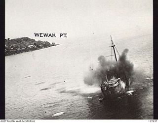 WEWAK, NEW GUINEA. 1944-03-19. AN JAPANESE SHIP SHOWING THE EFFECTS OF A DIRECT HIT DURING AN ATTACK BY BOSTON BOMBER AIRCRAFT