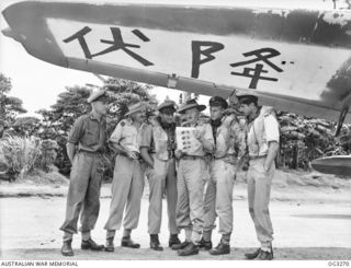 TOROKINA, BOUGAINVILLE ISLAND, SOLOMON ISLANDS. 1945-08-17. THE CREW OF ONE OF THE BEAUFORT AIRCRAFT OF NO. 10 LOCAL AIR SUPPLY UNIT RAAF THAT DROPPED LEAFLETS CONTAINING THE NEWS OF JAPAN'S ..