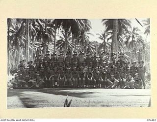 MADANG, NEW GUINEA. 1944-07-03. PERSONNEL OF BATTALION HEADQUARTERS, HEADQUARTERS COMPANY, 24TH INFANTRY BATTALION. IDENTIFIED PERSONNEL ARE:- LANCE CORPORAL A. MATTERS (1); LANCE CORPORAL L. ALLEN ..