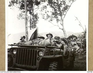 AN AUSTRALIAN ARMY JEEP LEAVING OWERS' CORNER LOADED WITH THE CAMERAS AND EQUIPMENT OF CHAUVEL ENTERPRISES LTD., WHO ARE PHOTOGRAPHING THE FINAL SEQUENCES OF THE "RATS OF TOBRUK" IN THE AREA