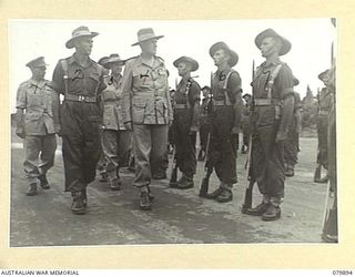 AITAPE, NEW GUINEA. 1945-03-23. LORD WAKEHURST, KCMG, GOVERNOR OF NEW SOUTH WALES (4), ACCOMPANIED BY THE GENERAL OFFICER COMMANDING 6 AUSTRALIAN DIVISION MAJOR- GENERAL J.E.S. STEVENS, DSO, ED (1) ..