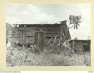 KAMANDRAN MISSION, NEW BRITAIN. 1945-02-17. A BADLY STRAFED BUILDING NEAR THE MELKONG RIVER WHICH WAS ONCE OCCUPIED BY THE JAPANESE FORCES IN THE AREA