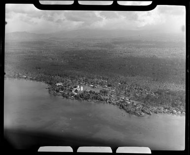 Apia, Upolu, Samoa, showing buildings and huts