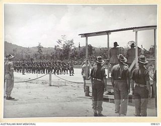 WEWAK, NEW GUINEA. 1945-10-26. A CEREMONIAL PARADE AND MARCH PAST BY 6 DIVISION WAS INSPECTED BY GENERAL SIR THOMAS A. BLAMEY, COMMANDER-IN-CHIEF, ALLIED LAND FORCES, SOUTH WEST PACIFIC AREA, AT ..